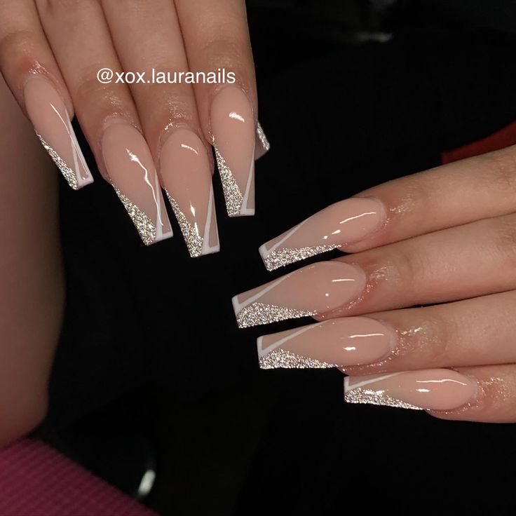 Chic Glossy Nude Acrylic Nails with Elegant Silver Glitter Tips for Sophisticated Glamour.