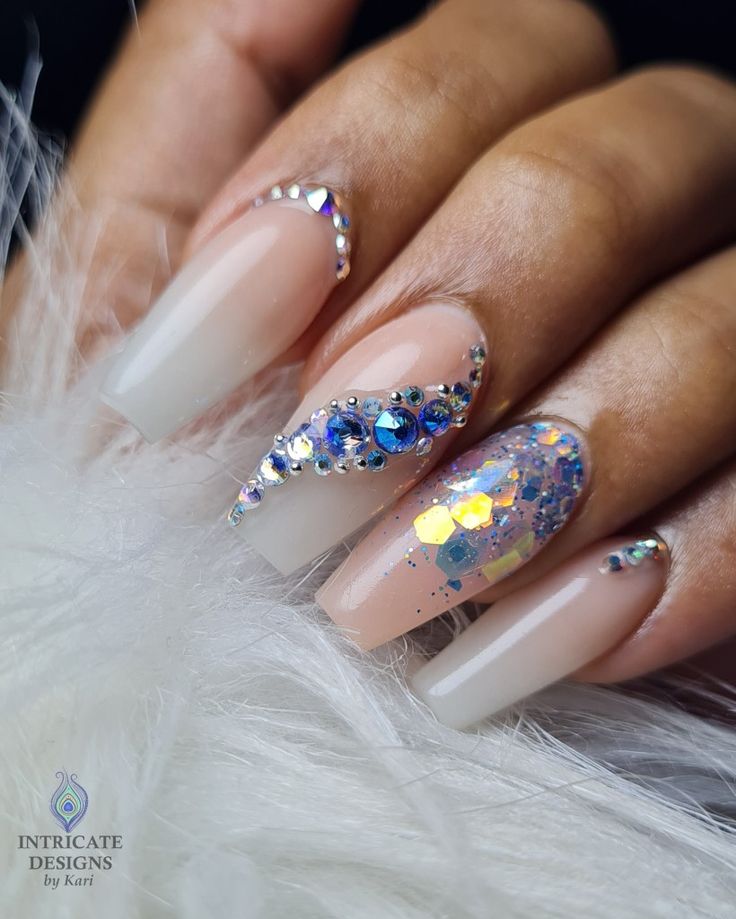 Sophisticated Nail Design: Neutral Base Enhanced with Iridescent Rhinestones and Colorful Glitter