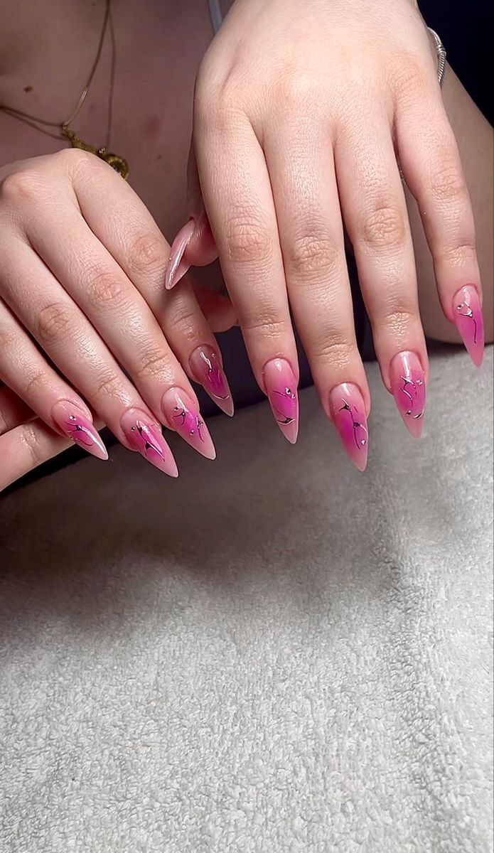 Chic Stiletto Nail Design: Soft Pink Gradient with Floral Accents