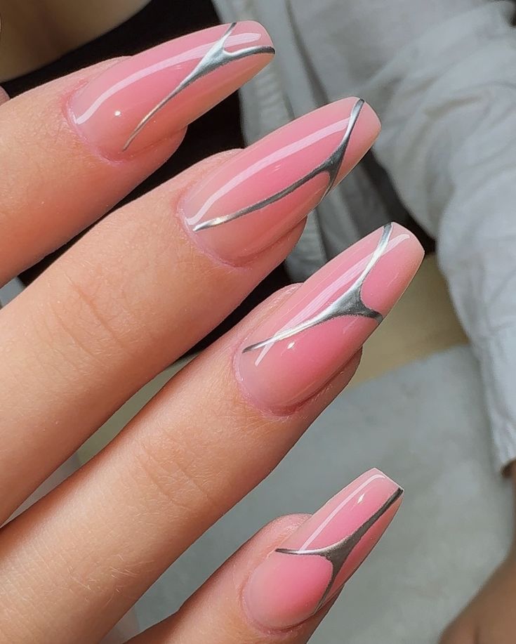 Elegant Pink Manicure with Sleek Metallic Silver Accents.