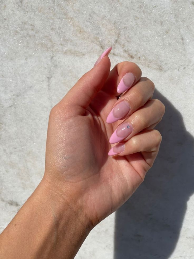 Chic Pink French Tip Nails with Glamorous Embellishment