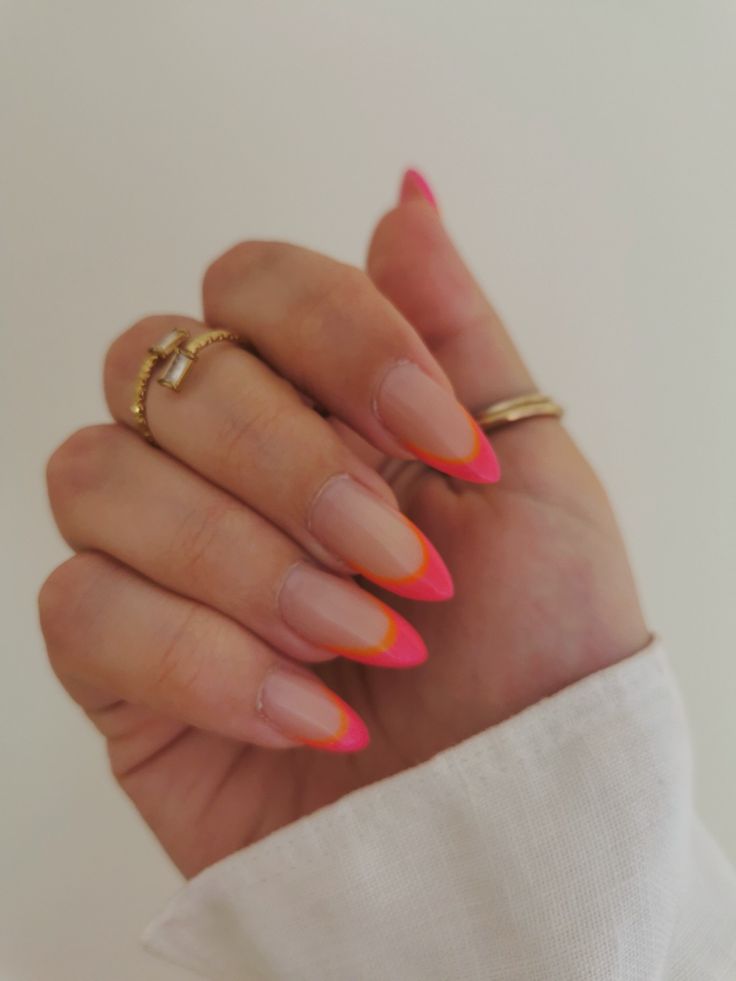 Vibrant Pink Ombre Stiletto Nails: A Playful Touch of Color and Flair.