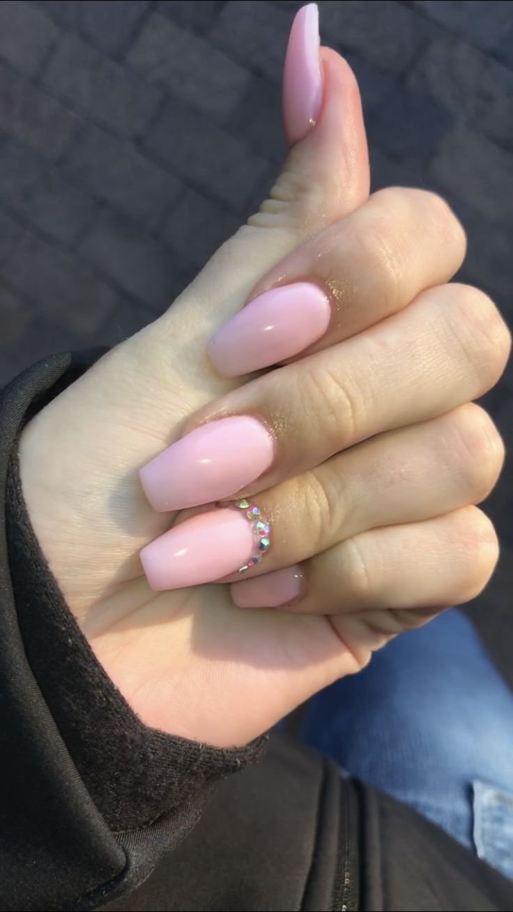 Chic Glossy Pink Nails with Glamorous Rhinestone Accent