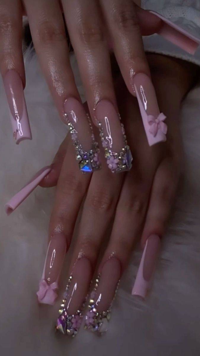 Elegant Glossy Pink Long Nails with Gem and Floral Embellishments