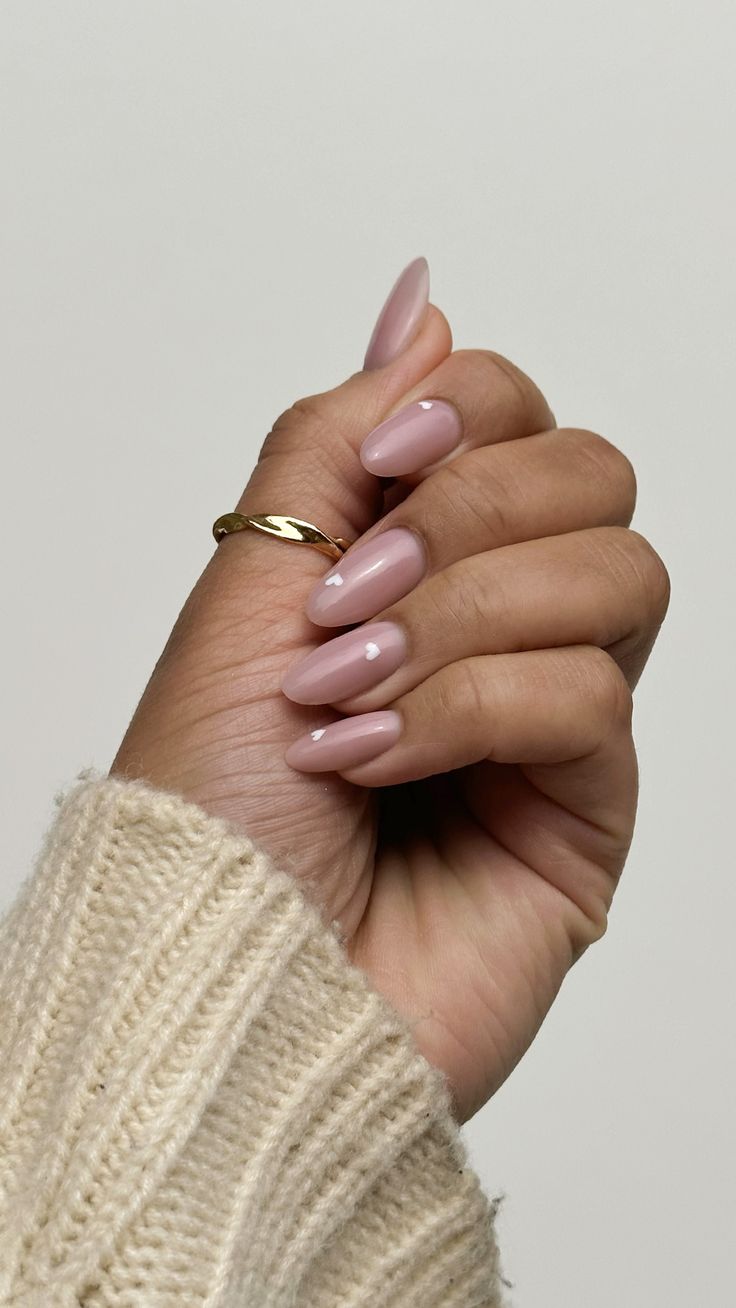 Sophisticated Glossy Nude Almond Nails with Delicate Gold Accents.