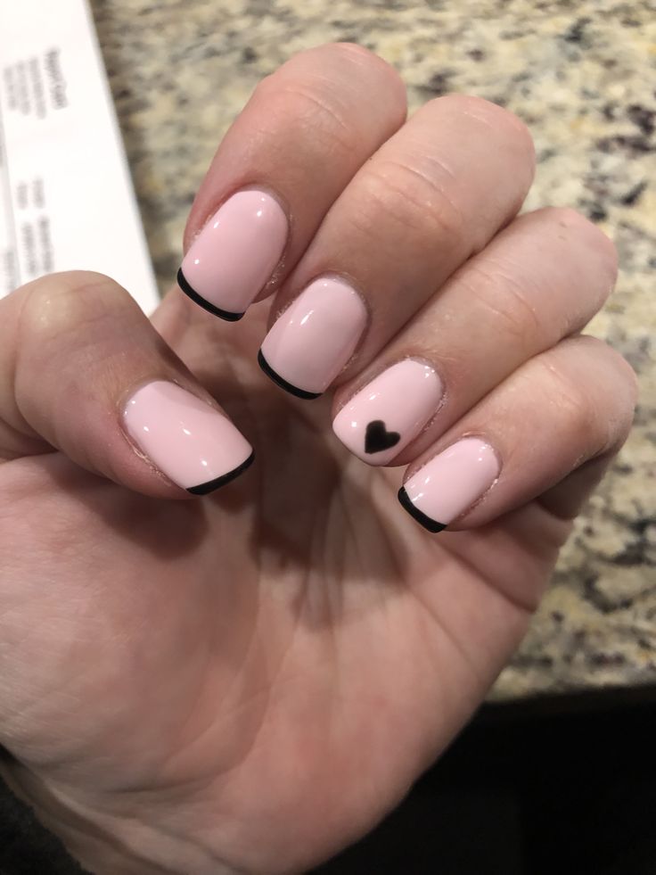 Chic Soft Pink and Black Tip Nail Design with Heart Accent