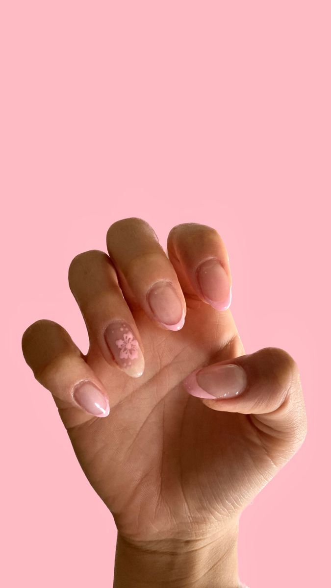 Elegant Chic Nail Design with Soft Pink Base and Floral Accents