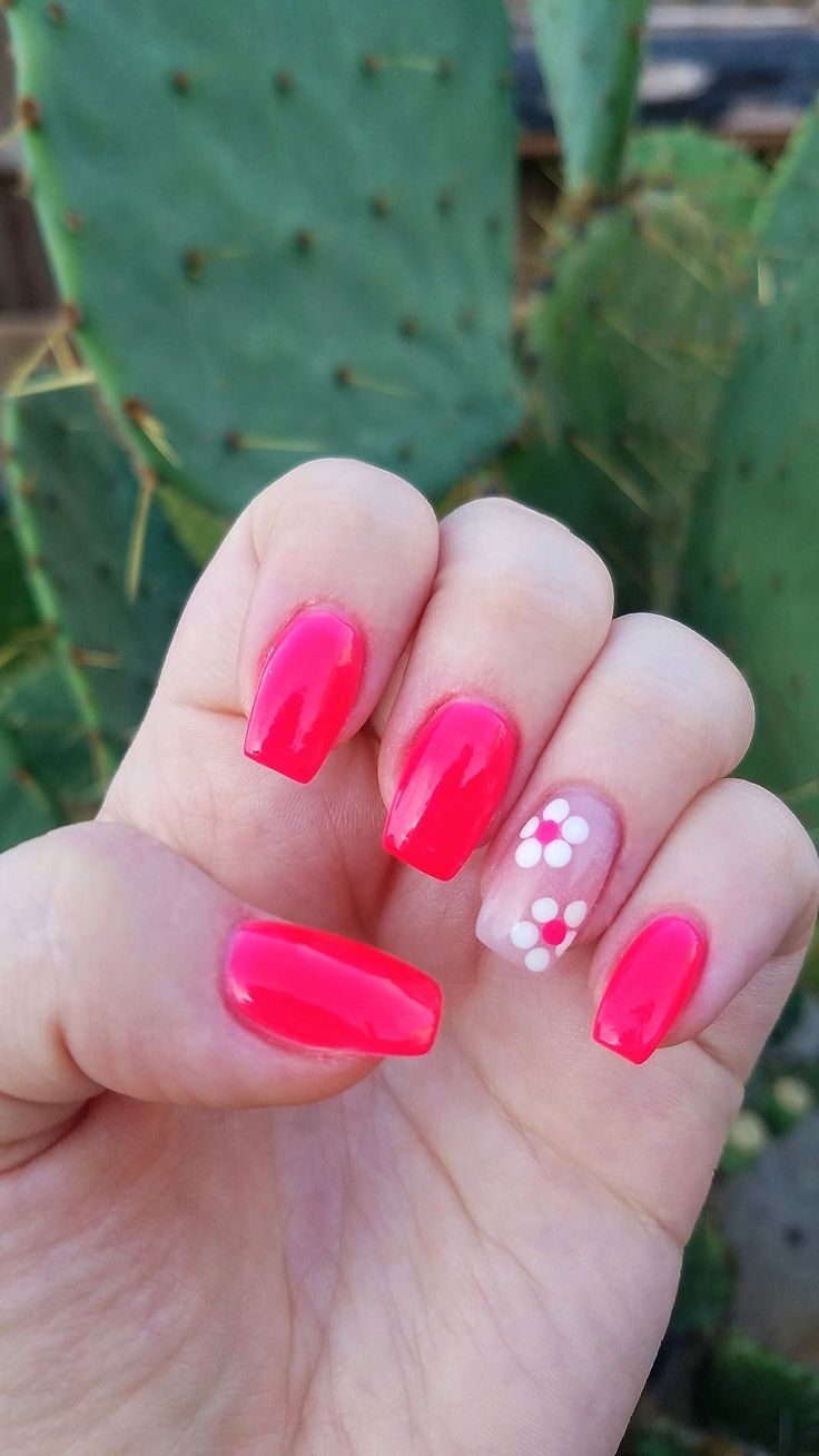 Bold Vibrant Pink Manicure with Playful Floral Accent Nail for Adventurous Spirit.