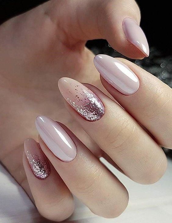 Chic Almond-Shaped Nail Design with Soft Pink and Sparkling Accents