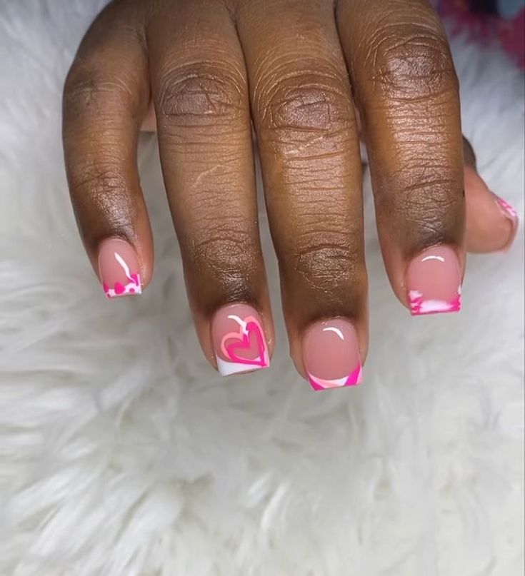 Charming Soft Nude Nail Design with Vibrant Pink Accents and Sophisticated White Tips.