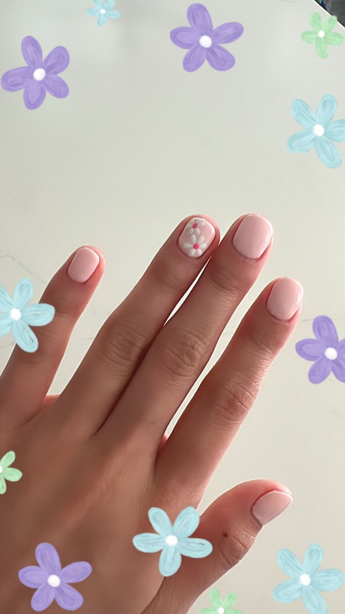 Elegant Pastel Pink Nail Design with Playful Floral Accents for a Cheerful Spring and Summer Look.