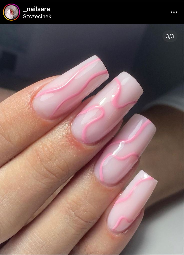 Charming Soft Pink Nail Design with Vibrant Accents and Wavy Patterns.