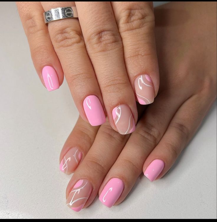 Chic Glossy Pink Manicure with Elegant White Swirls for Any Occasion.