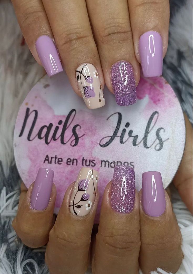 Elegant Lavender and Nude Nail Design with Floral Patterns and Sparkling Accent