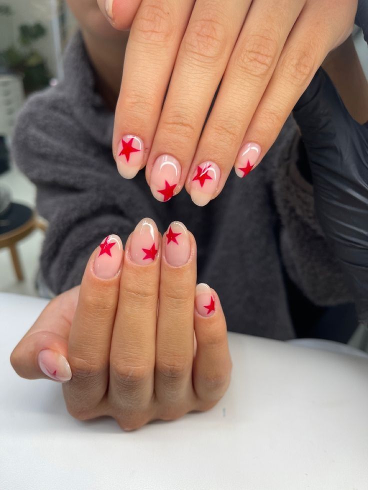 Playful and Stylish Nail Design Featuring Bright Red Star Motifs