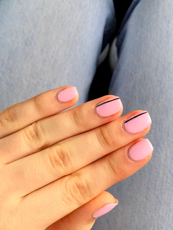 Chic Minimalist Pastel Pink Nails with Elegant Black Accents.