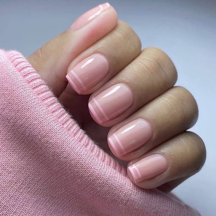 Sophisticated Minimalist Manicure with Soft Pink Base and Delicate Tips.