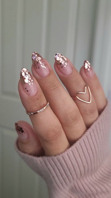 Chic Gradient Nude and Glitter Nail Design with Dainty Ring Accents.