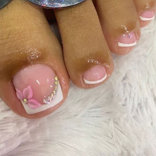 Elegant Floral Nail Art with Soft Pink Hues and Custom French Tips