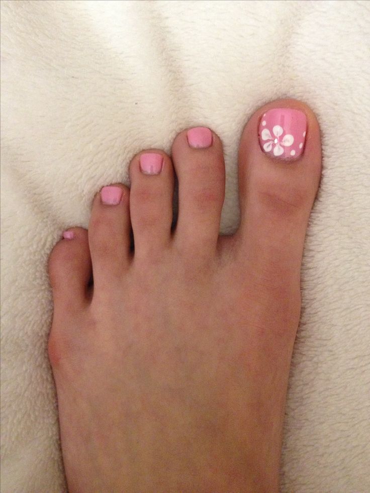 Charming Pink Pastel Nail Design with Floral Accents for a Cheerful Summer Look.