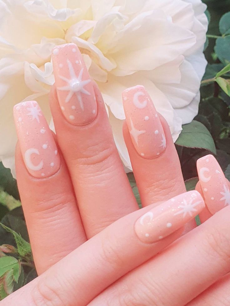 Dreamy Pastel Nails with Celestial Stars and Moons Design