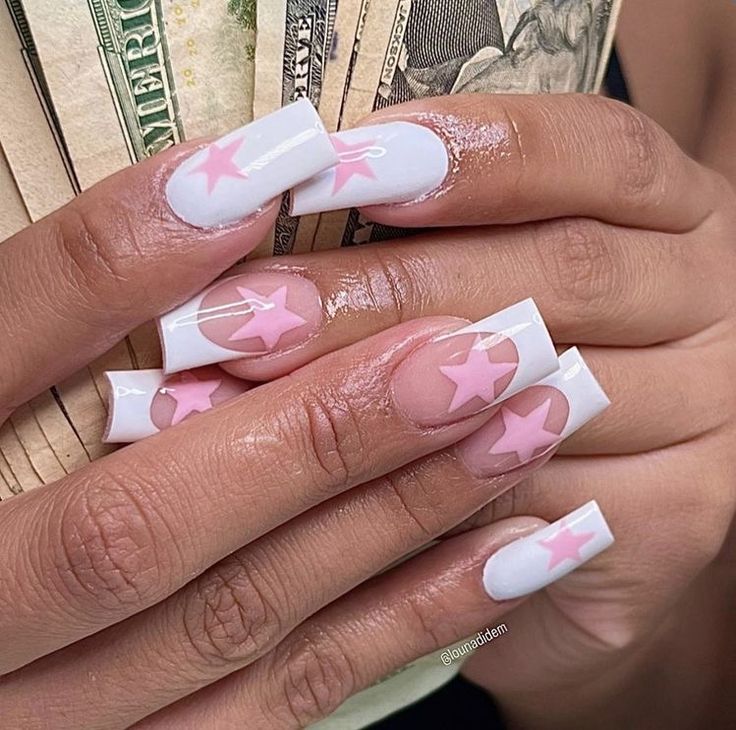 Chic Whimsical Nail Design: Glossy White Base with Playful Soft Pink Star Motifs