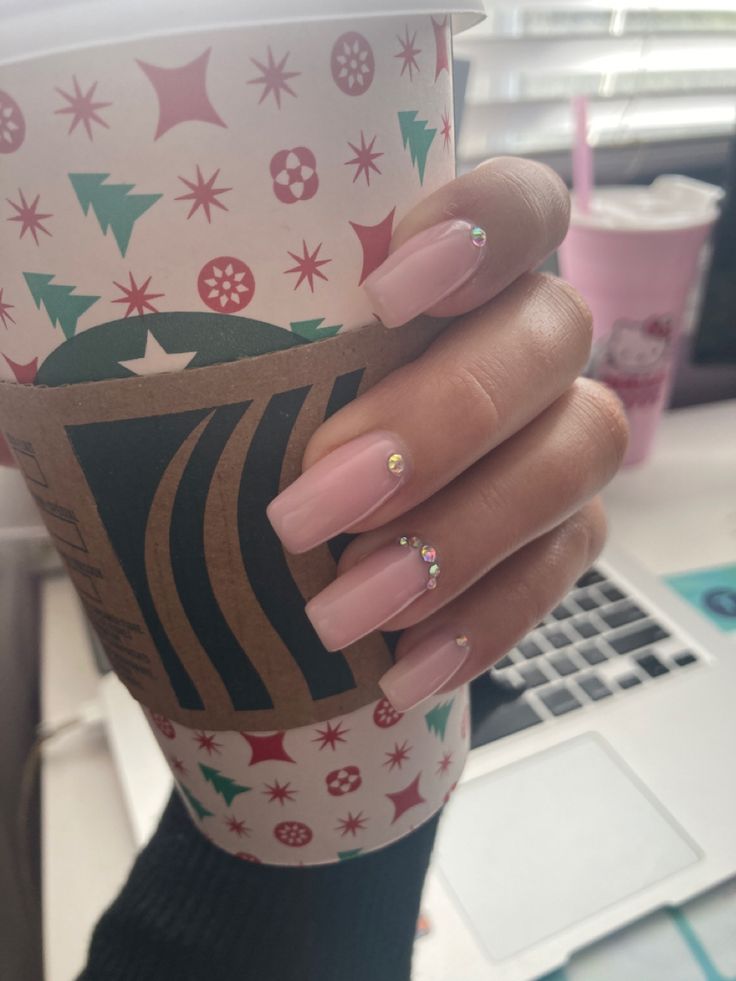 Elegant Soft Pink Long Nails with Rhinestones: A Chic Seasonal Look.