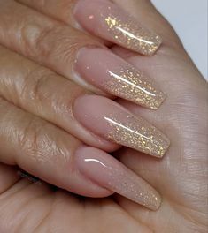 Elegant Ombre Nail Design: Soft Nude and Shimmering Gold Glitter Blend