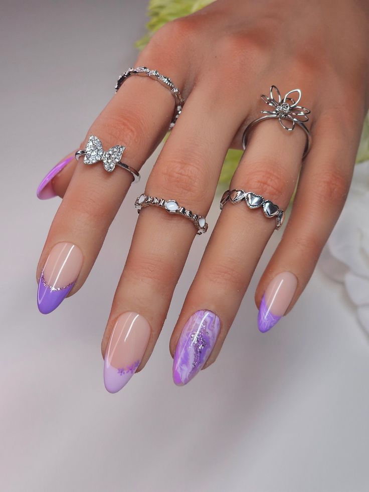 Sophisticated Ombre Purple Nail Design with Glossy Finishes and Intricate Silver Rings