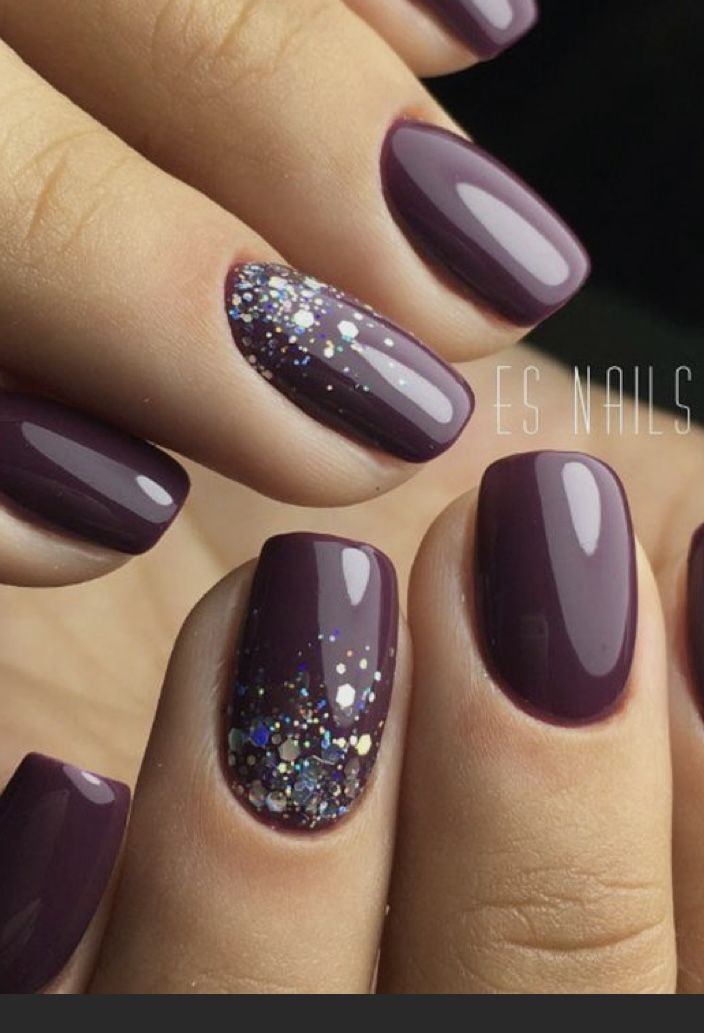 Sophisticated Deep Plum Nail Design Accented with Glitter for a Playful Contrast.