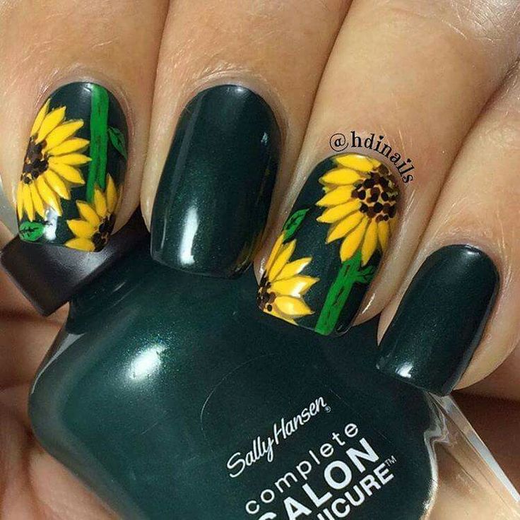 Whimsical Dark Green Nail Design Adorned with Vibrant Sunflowers.