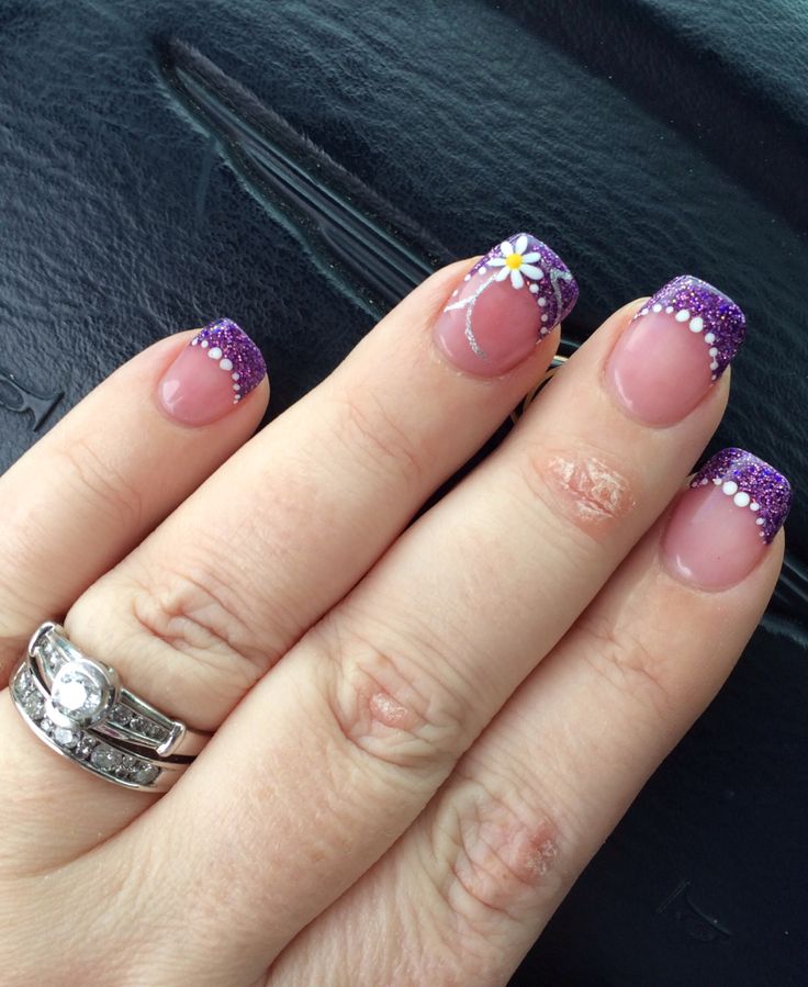 Stunning Purple French Tips with Glitter, Daisies, and Pearls for Elegant Occasions.