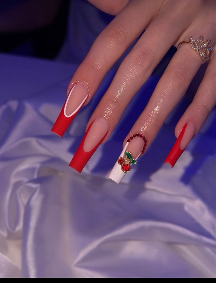 Bold Red and White Nail Design with Playful Cherry Accents and Glossy Finish.