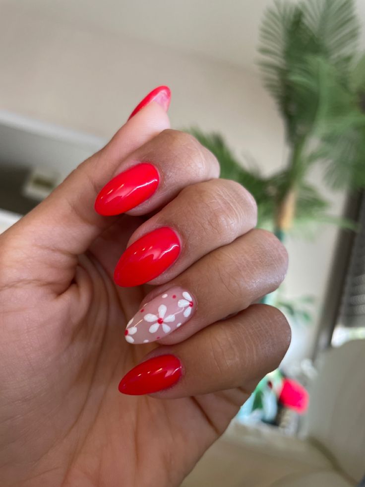 Vibrant Red Floral Nails: A Striking Blend of Elegance and Playfulness.