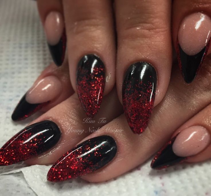 Edgy Glamour: Black and Nude Nail Design with Sparkling Red Glitter Tips