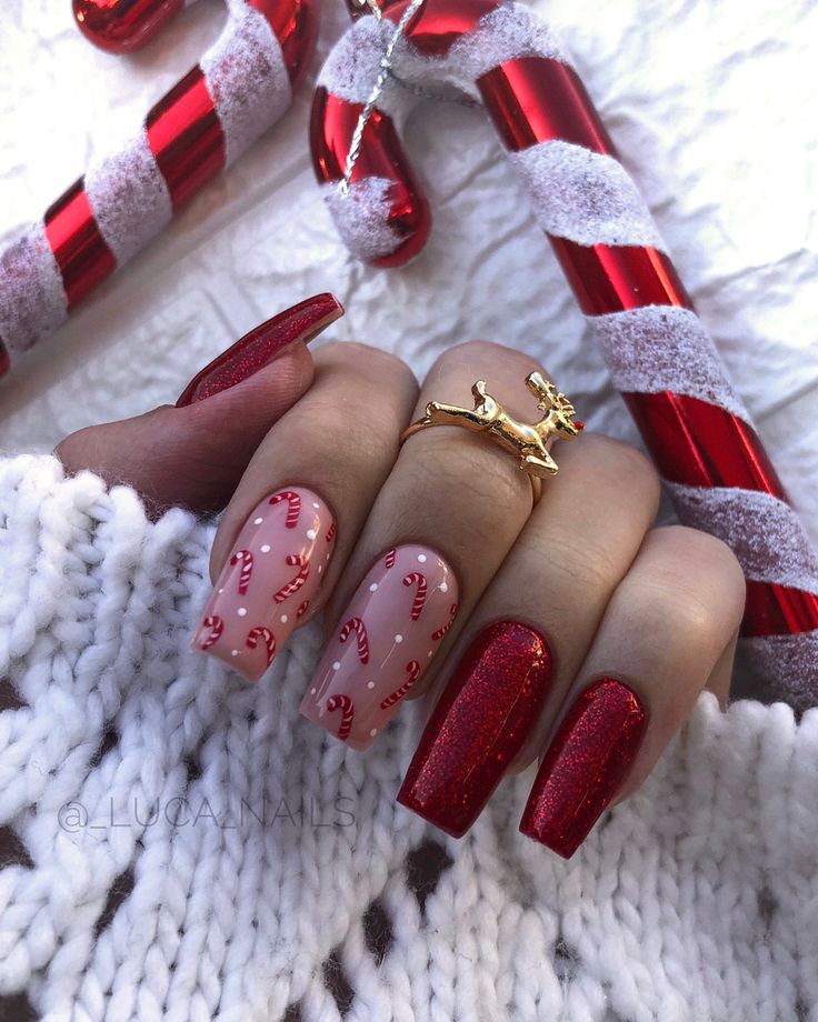 Vibrant Festive Nail Design with Red and Pink Hues, Candy Canes, and Glitter Accents.