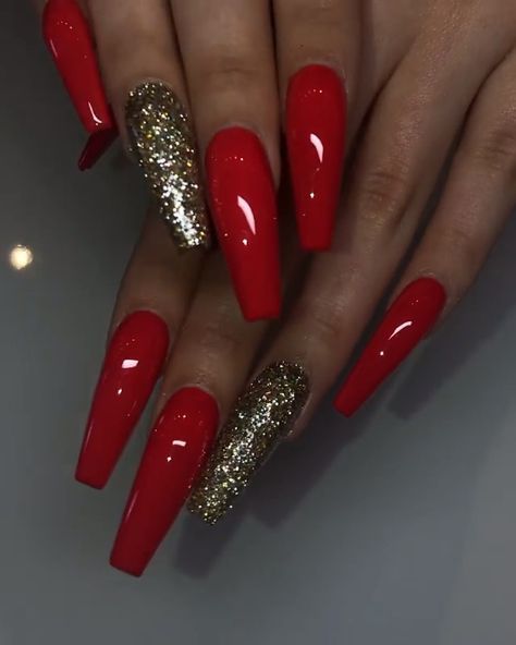 Chic and Bold: Striking Red Nails Enhanced with Dazzling Gold Glitter