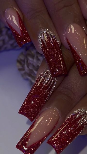 Stunning Metallic Red Gradient Nail Design with Glitter Accents.