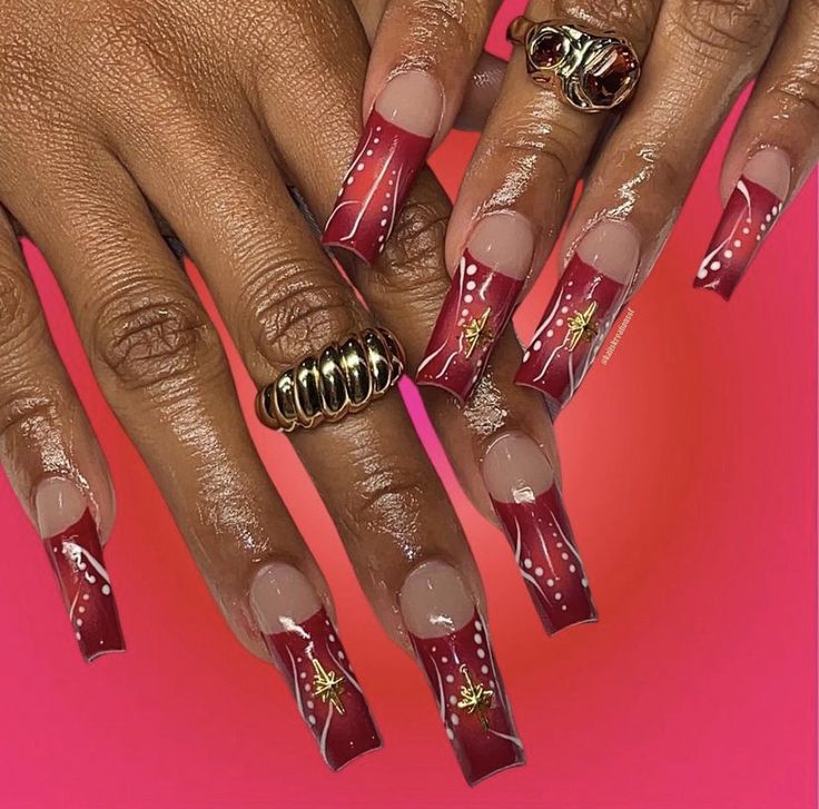 Sophisticated Gradient Acrylic Nails with Intricate Detailing and Bold Accessories.