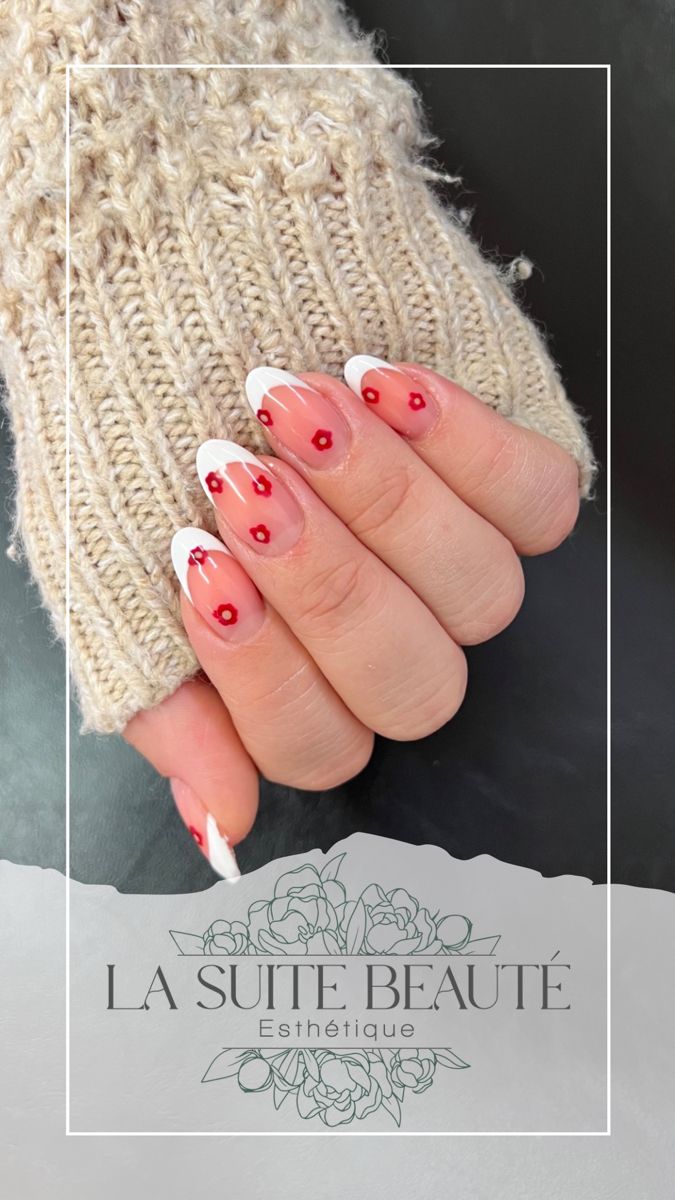 Chic Nude and White Nail Design with Red Floral Accents