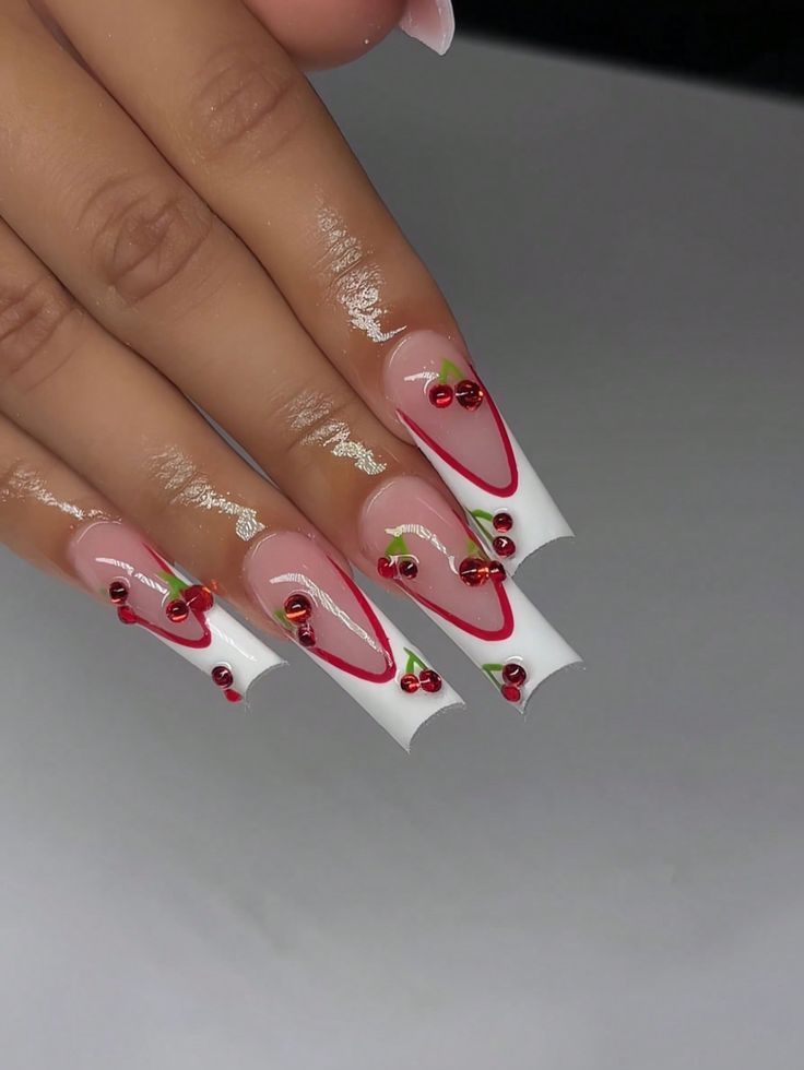 Playful Cherry-Themed Nail Design with Glossy Nude and Vibrant White Polish Accents