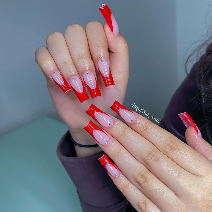 Chic Red and Nude Nail Design with Elegant Embellishments