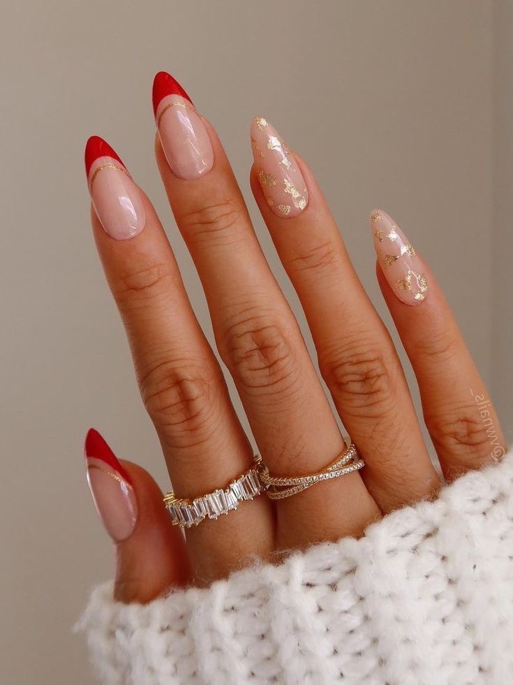 Chic Almond-Shaped Nail Design Featuring Bold Red Tips and Elegant Gold Accents