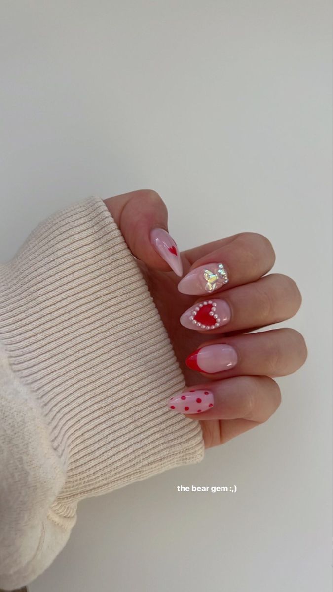 Whimsical Nail Design: Soft Pink and Vibrant Red with Heart Embellishments