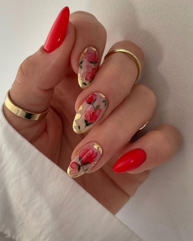 Elegant Almond-Shaped Nails: Glossy Red with Hand-Painted Floral Designs and Gold Accents.