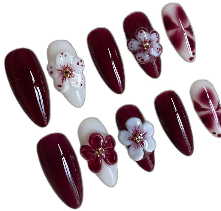 Elegant Deep Burgundy Nail Design with Feminine Floral Embellishments