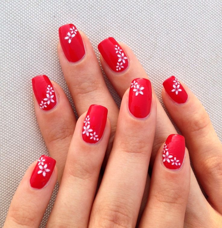 Elegant Red and White Floral Nail Design: Perfect for Any Occasion.