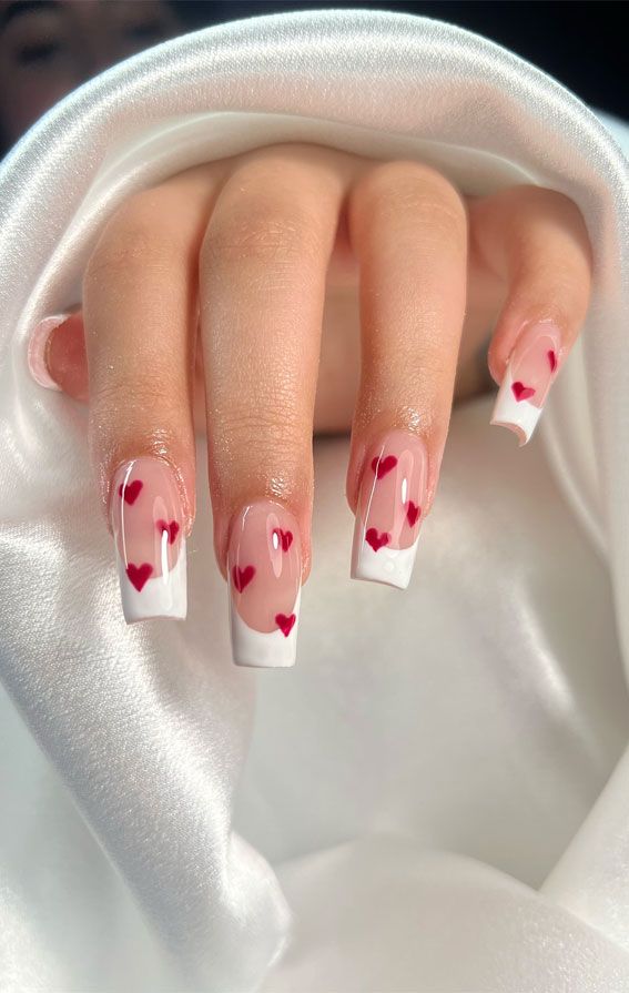 Romantic Heart-Themed Nail Design: Pink Base with Glossy French Tips and Red Hearts