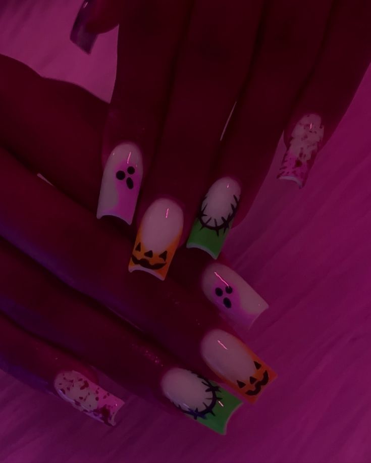 Festive Halloween Nail Design with Vibrant Colors and Whimsical Motifs.