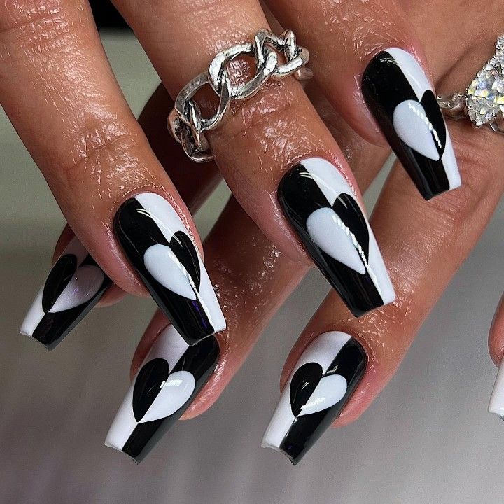 Chic Bold Black and White Heart Nail Design with Glossy Finish